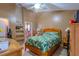 Cozy bedroom with comfortable furnishings, a ceiling fan, and neutral decor for a relaxing atmosphere at 1161 Hackberry Dr, Orlando, FL 32825