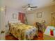 Cozy bedroom featuring a ceiling fan, light pink walls, and a comfortable-looking bed at 1161 Hackberry Dr, Orlando, FL 32825