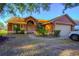 Charming one-story home with well-maintained landscaping and an inviting front entrance in a suburban neighborhood at 1161 Hackberry Dr, Orlando, FL 32825