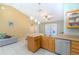 Well-lit kitchen with stainless steel appliances, a breakfast bar, and a view of the outdoor pool area at 1161 Hackberry Dr, Orlando, FL 32825
