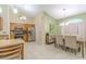 Open concept kitchen and dining area with stainless steel appliances and dining table at 1161 Hackberry Dr, Orlando, FL 32825