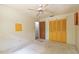 Bedroom with fan and wall closet, featuring ample space for storage and comfort at 1221 Adams St, Longwood, FL 32750