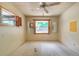 Bedroom with two windows and ceiling fan, offering natural light and ventilation at 1221 Adams St, Longwood, FL 32750