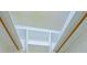 A bright white, walk-in closet with multiple shelves and rods for maximum storage at 1221 Adams St, Longwood, FL 32750