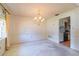 Dining room with chandelier, view to kitchen and paneled wall at 1221 Adams St, Longwood, FL 32750
