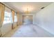 Spacious living room with large windows and a chandelier at 1221 Adams St, Longwood, FL 32750