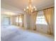 Large living room featuring a chandelier and bright windows at 1221 Adams St, Longwood, FL 32750