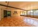 Enclosed sunroom with tile flooring and plenty of natural light at 1221 Adams St, Longwood, FL 32750