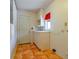 Functional utility room with storage cabinets and tile flooring at 1221 Adams St, Longwood, FL 32750