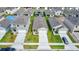 Aerial view of a single-Gathering home with a well-maintained lawn and a private driveway at 1221 August Sky Dr, Deltona, FL 32738