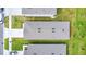 Birds-eye view of rooftops and neatly landscaped yards in a suburban residential neighborhood at 1221 August Sky Dr, Deltona, FL 32738