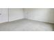 Neutral bedroom with two doors and neutral carpeting at 1221 August Sky Dr, Deltona, FL 32738