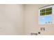 This laundry room features a window, hookups for a washer and dryer, and light-colored walls at 1221 August Sky Dr, Deltona, FL 32738