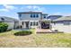 Expansive backyard view featuring a trampoline and patio, perfect for outdoor activities and Gathering fun at 13320 Magnolia Valley Dr, Clermont, FL 34711