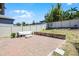 Spacious backyard features a patio and privacy fence, offering a serene outdoor retreat at 13320 Magnolia Valley Dr, Clermont, FL 34711