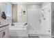 Bright bathroom featuring a glass enclosed shower and separate tub at 13320 Magnolia Valley Dr, Clermont, FL 34711