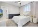 Modern bedroom with a large window, a plush bed, and contemporary decor, offering a serene and comfortable space at 13320 Magnolia Valley Dr, Clermont, FL 34711