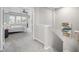 Hallway leading to bedroom with plush carpet and modern accents at 13320 Magnolia Valley Dr, Clermont, FL 34711