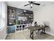 Home office features stylish shelving, a large desk, and an ergonomic chair for a productive work environment at 13320 Magnolia Valley Dr, Clermont, FL 34711