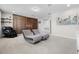 Open living space with lounge chairs and modern decor, perfect for relaxation at 13320 Magnolia Valley Dr, Clermont, FL 34711