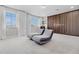 Spacious loft area with stylish seating and ample natural light at 13320 Magnolia Valley Dr, Clermont, FL 34711