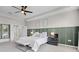 Comfortable bedroom featuring a ceiling fan, decorative wall art, and plush carpet at 13320 Magnolia Valley Dr, Clermont, FL 34711