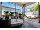 Screened patio area featuring lounge seating, a hammock and outdoor grill at 13320 Magnolia Valley Dr, Clermont, FL 34711