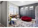 Playroom with natural light, a soft rug, and fun toys and storage, creating an inviting and organized play space at 13320 Magnolia Valley Dr, Clermont, FL 34711