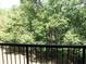 Enjoy lush green scenery from this balcony with black metal railings at 143 Villa Di Este Ter # 205, Lake Mary, FL 32746
