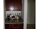 Elegant bar area with a granite countertop, perfect for entertaining guests and enjoying refreshments at 143 Villa Di Este Ter # 205, Lake Mary, FL 32746