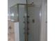 Bright bathroom featuring a glass-enclosed shower with built-in shelving and chrome fixtures at 143 Villa Di Este Ter # 205, Lake Mary, FL 32746