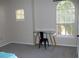 Bright bedroom with a simple desk by two sunlit windows at 143 Villa Di Este Ter # 205, Lake Mary, FL 32746