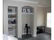 Stylish built-in shelves and decor enhance the living space, creating a cozy and inviting ambiance at 143 Villa Di Este Ter # 205, Lake Mary, FL 32746