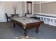 Game room features a billiard table, seating, and tasteful decor for entertainment at 143 Villa Di Este Ter # 205, Lake Mary, FL 32746