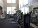 Community gym featuring multiple workout machines, mirrors, and ample lighting at 143 Villa Di Este Ter # 205, Lake Mary, FL 32746