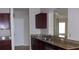 Well-appointed kitchen with granite countertops and ample cabinet space, perfect for culinary adventures at 143 Villa Di Este Ter # 205, Lake Mary, FL 32746