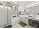 Spacious bathroom with a large window, walk-in shower, soaking tub and double vanity at 14378 Stamford Cir, Orlando, FL 32826