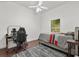 Bedroom with a desk, chair, window with natural light and hardwood floors at 14378 Stamford Cir, Orlando, FL 32826