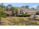 Charming front exterior showcasing a well-maintained lawn and beautiful landscaping around the home at 14378 Stamford Cir, Orlando, FL 32826