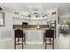 Bright kitchen with granite countertops, stainless steel appliances and breakfast bar with seating at 14378 Stamford Cir, Orlando, FL 32826