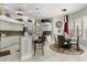 Modern kitchen with granite countertops, stainless steel appliances, and a breakfast bar at 14378 Stamford Cir, Orlando, FL 32826