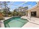 Inviting pool with a screened enclosure offers an outdoor living space with a covered lanai at 14378 Stamford Cir, Orlando, FL 32826