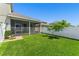 Backyard featuring well-maintained lawn and privacy fence at 1540 Softshell St, St Cloud, FL 34771