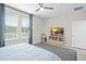 This primary bedroom boasts neutral paint, natural light, and a gray patterned rug at 1540 Softshell St, St Cloud, FL 34771