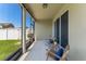 Screened patio with comfortable seating, perfect for enjoying the outdoors at 1540 Softshell St, St Cloud, FL 34771