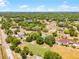 Lush, wooded property offering a peaceful retreat with mature trees, a well-maintained lawn, and neighborhood charm at 1689 Saboff Way, Chuluota, FL 32766