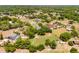 Serene, wooded property featuring a well-maintained lawn, mature landscaping, and a peaceful neighborhood ambiance at 1689 Saboff Way, Chuluota, FL 32766