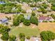 Secluded property with mature landscaping provides an excellent setting for the charming home; convenient to amenities at 1689 Saboff Way, Chuluota, FL 32766