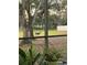 Backyard view of a deer grazing, as seen through a screened patio at 1689 Saboff Way, Chuluota, FL 32766