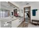 Spacious bathroom with double sinks and large mirror, conveniently located by the bedroom at 1689 Saboff Way, Chuluota, FL 32766